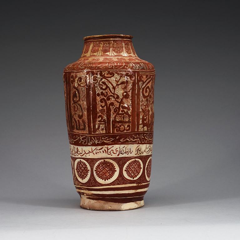 A JAR, lustre-decorated pottery. Height 32 cm. Central Persia (Iran) 12-13th century. Kashan style.
