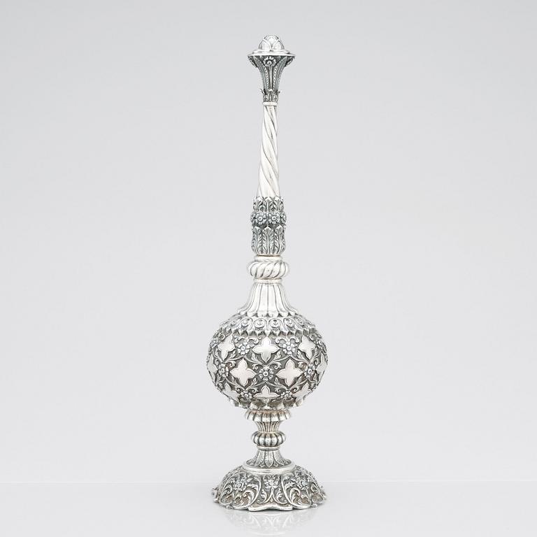 An 1880's british Raj repoussé silver rosewater sprinkler by Oomersi Mawji & Sons.