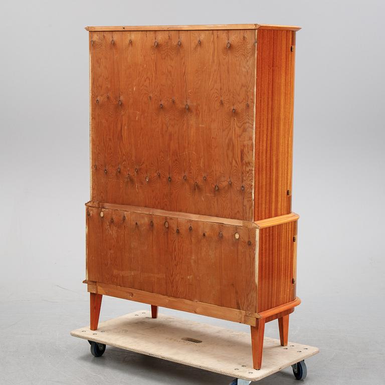 A mahogany veneered cabinet, mid 20th Century.