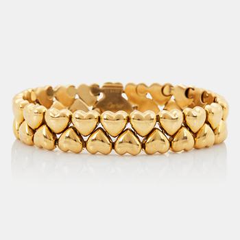 A Cartier 18K gold "Double Hearts" bracelet.