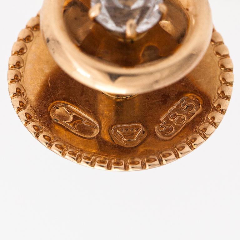 Elis Kauppi,  A pair of 14K gold buttons with rock crystals to a white tie shirt. Kupittaan kulta, Turku.