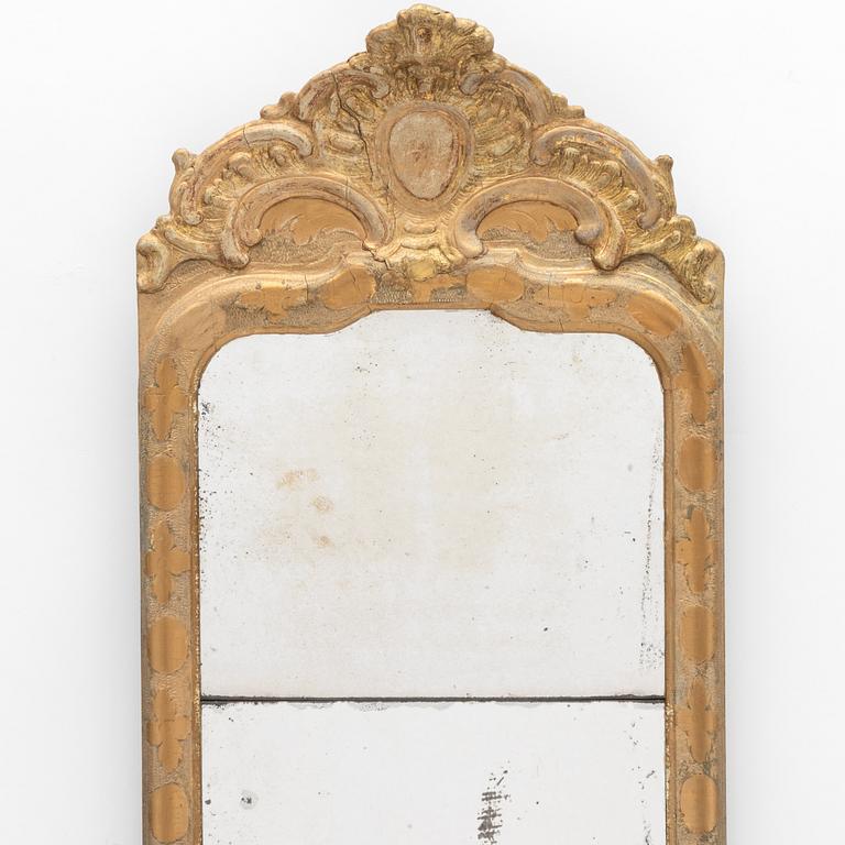 A Swedish rococo giltwood mirror, later part 18th century.