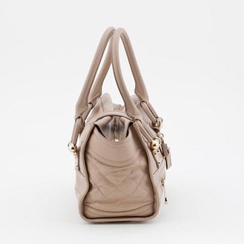 BURBERRY, a beige leather shoulder bag.