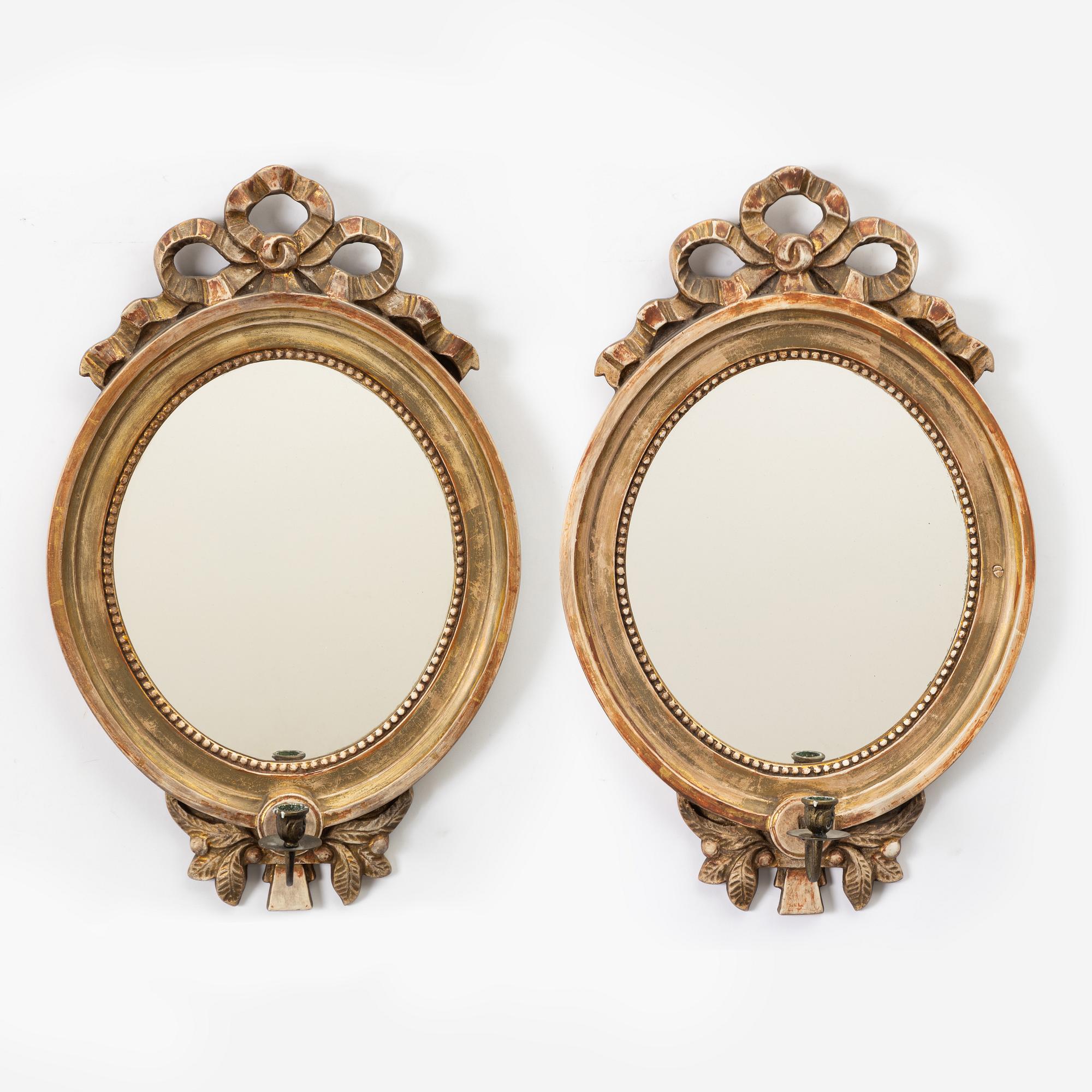 A pair of Gustavian one-light girandole mirrors, 20th century.