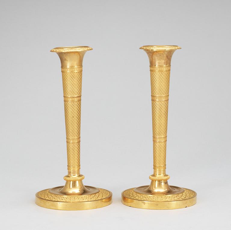 A pair of French Empire early 19th Century candlesticks.