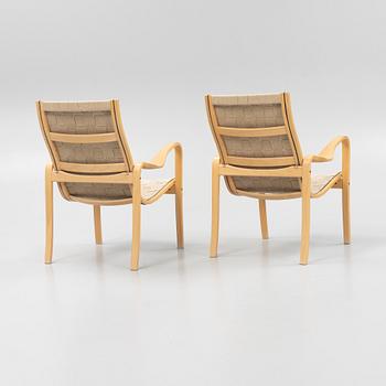 A pair of lounge chairs from Källemo.