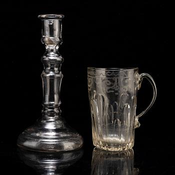 A glass cup with handle and a glass candle stick, 18/19th Century.