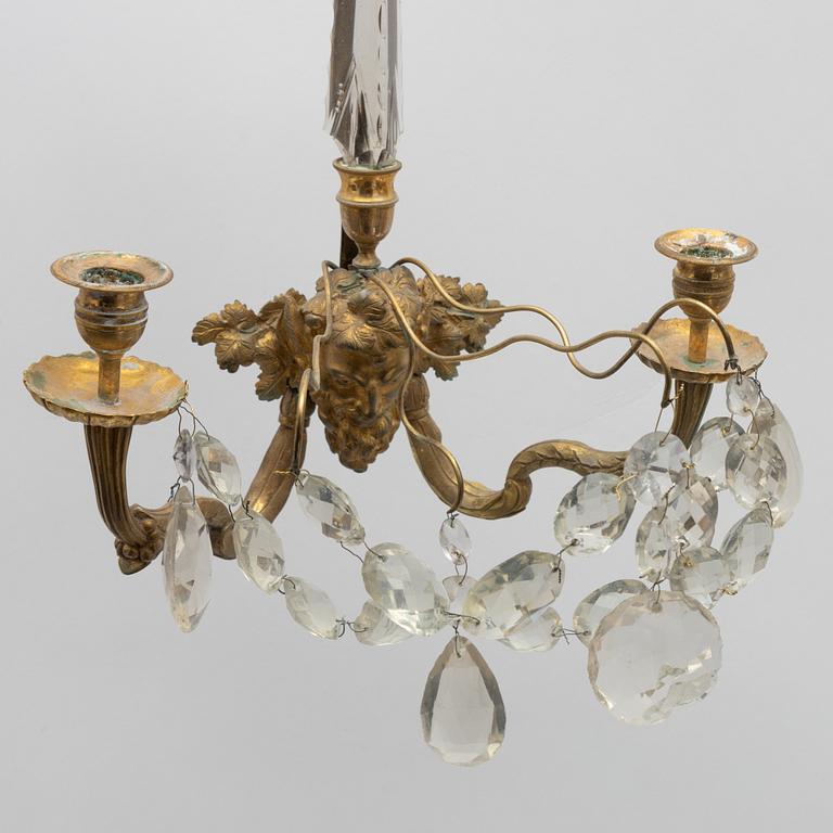 A pair of Louis XVI-style two-branch gilt-bronze and cut-glass appliques, larte 19th century.