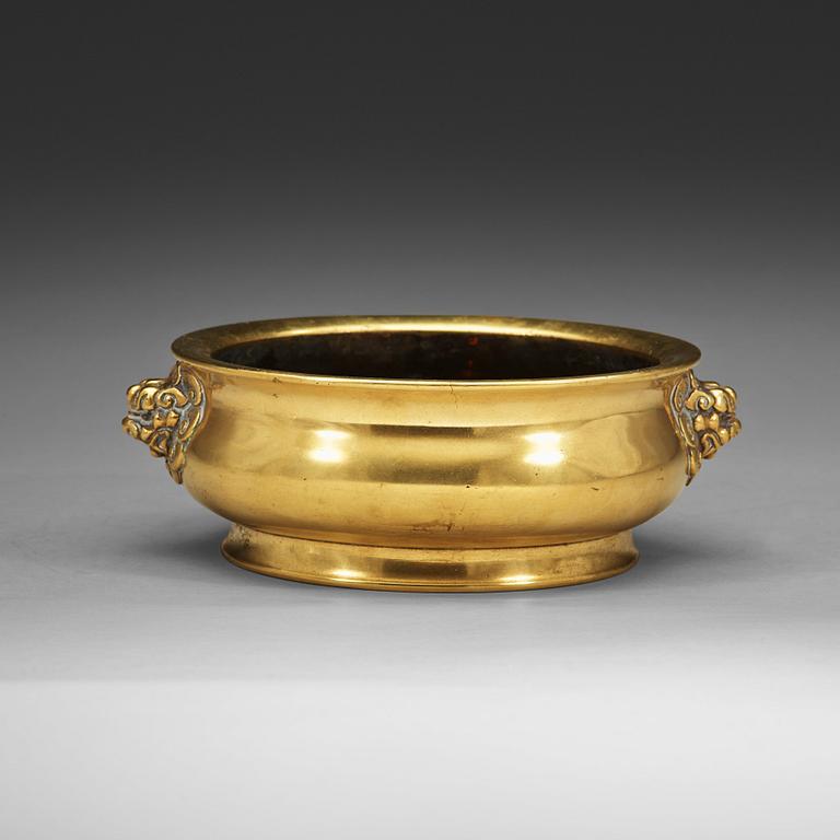 A polished bronze censer, Qing dynasty with Xuandes six character mark.