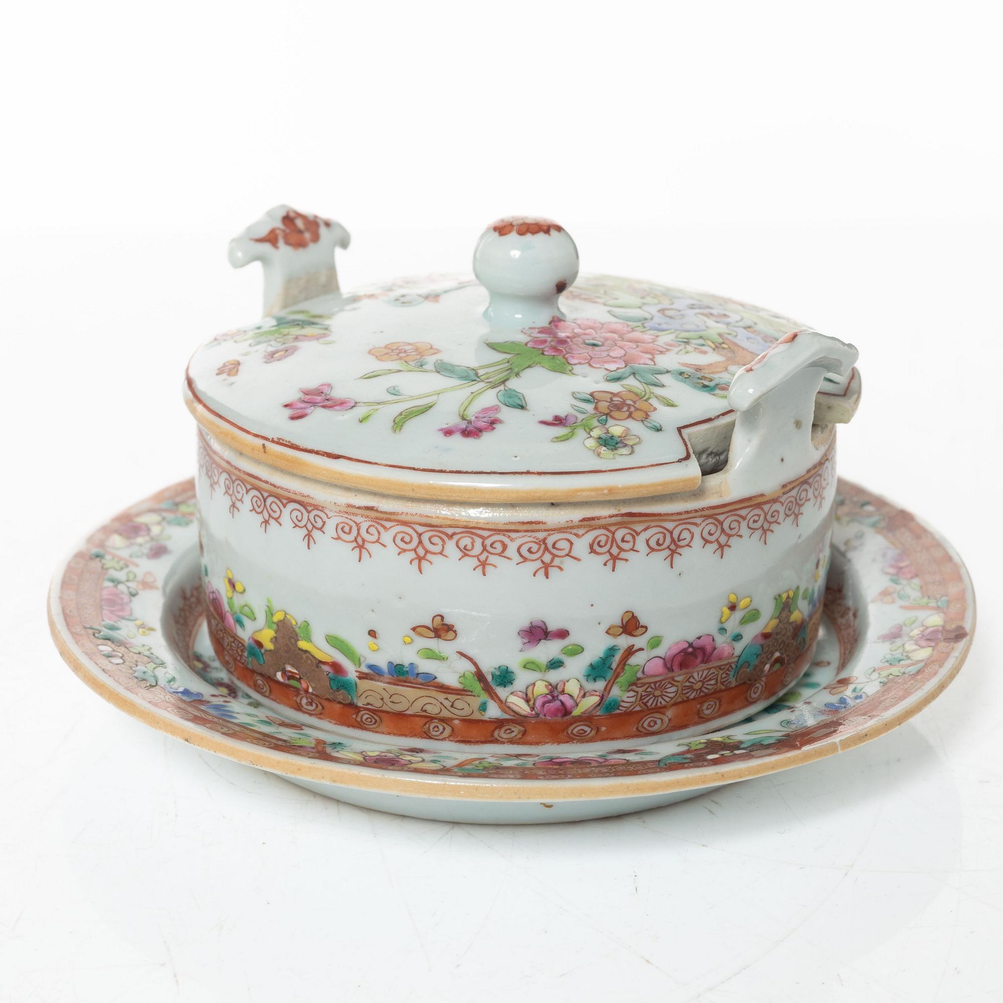 A small Chinese famille rose porcelain tureen with cover and stand, two salt cellars, Qing dynasty, Qianlong (1736-95).