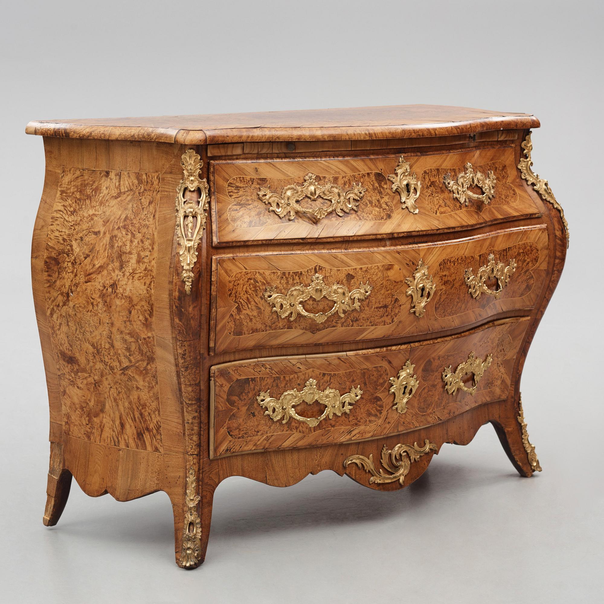 A burr-alder and gilt brass-mounted rococo commode by J. Sjölin (master 1767-1785).