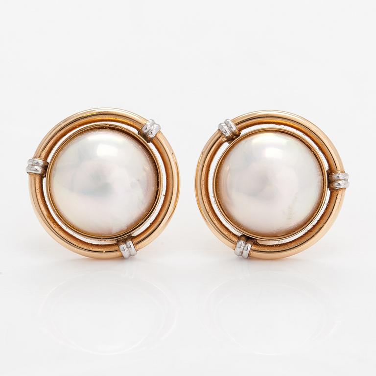 A pair of 14K gold and mabé pearl earrings.