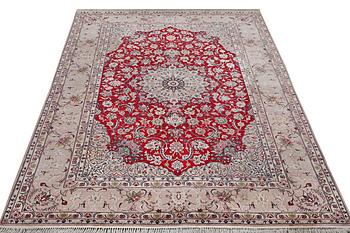 A signed Esfahan carpet, part silk, c. 298 x 206 cm.