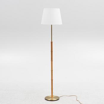 A brass and pine floor light from Falkenbergs, second part of the 20th Century.