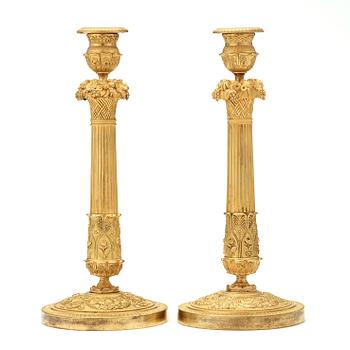 A pair of French mid 19th century candlesticks.