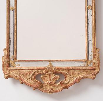 A Swedish giltwood and carved rococo mirror, later part of the 18th century.