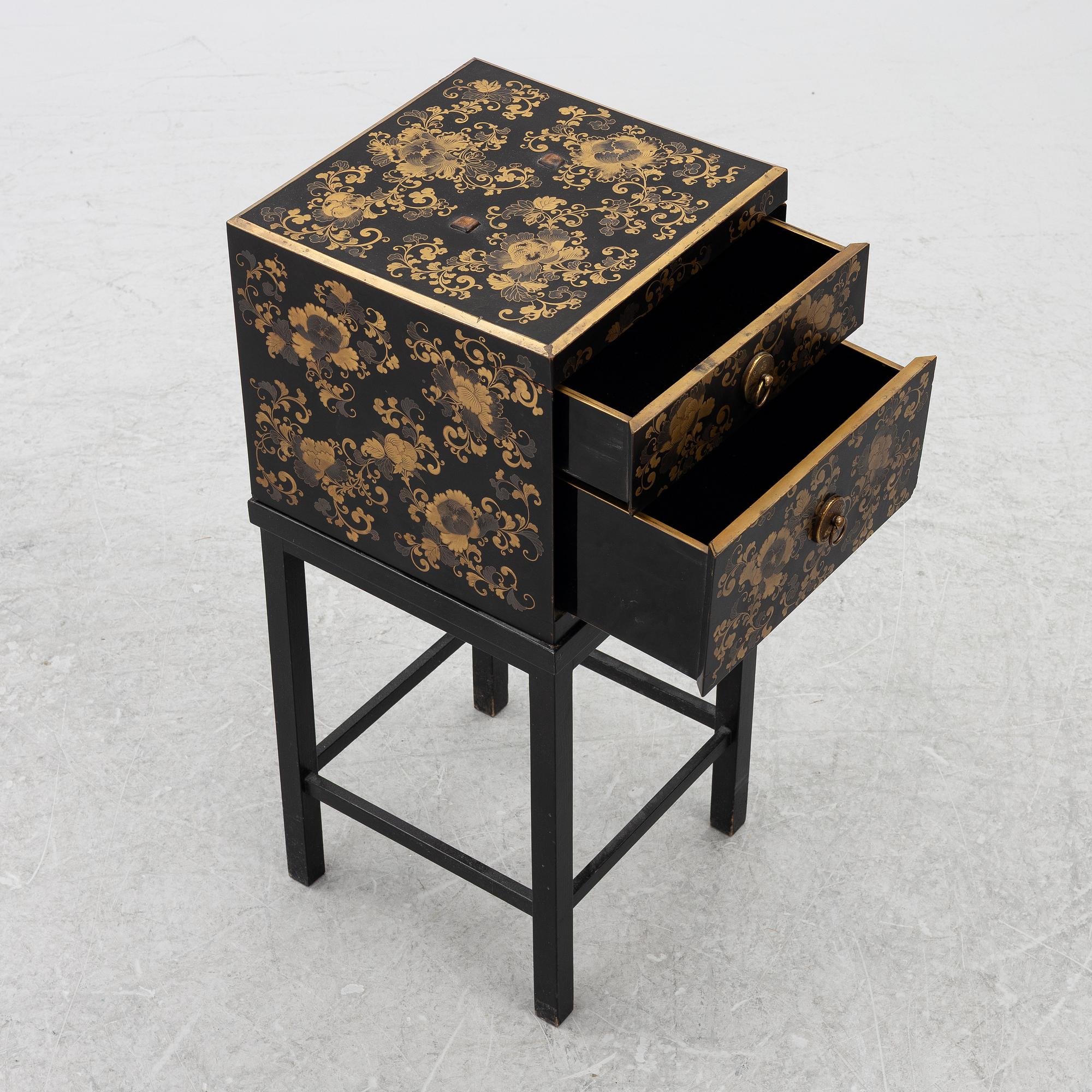 A lacquered end table/box with stand, Japan, 20th century.