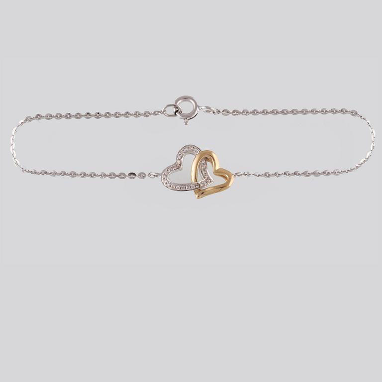 ARMBAND, 18K guld och vitguld med briljantslipade diamanter ca 0.07 ct. Vikt 2,0 gram.