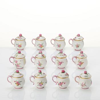 A set of 12 Swedish Marieberg soft paste custard cups with covers, 18th century.