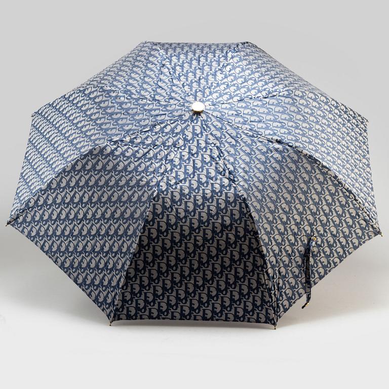 CHRISTIAN DIOR, a set of a clutch, a belt and an umbrella.