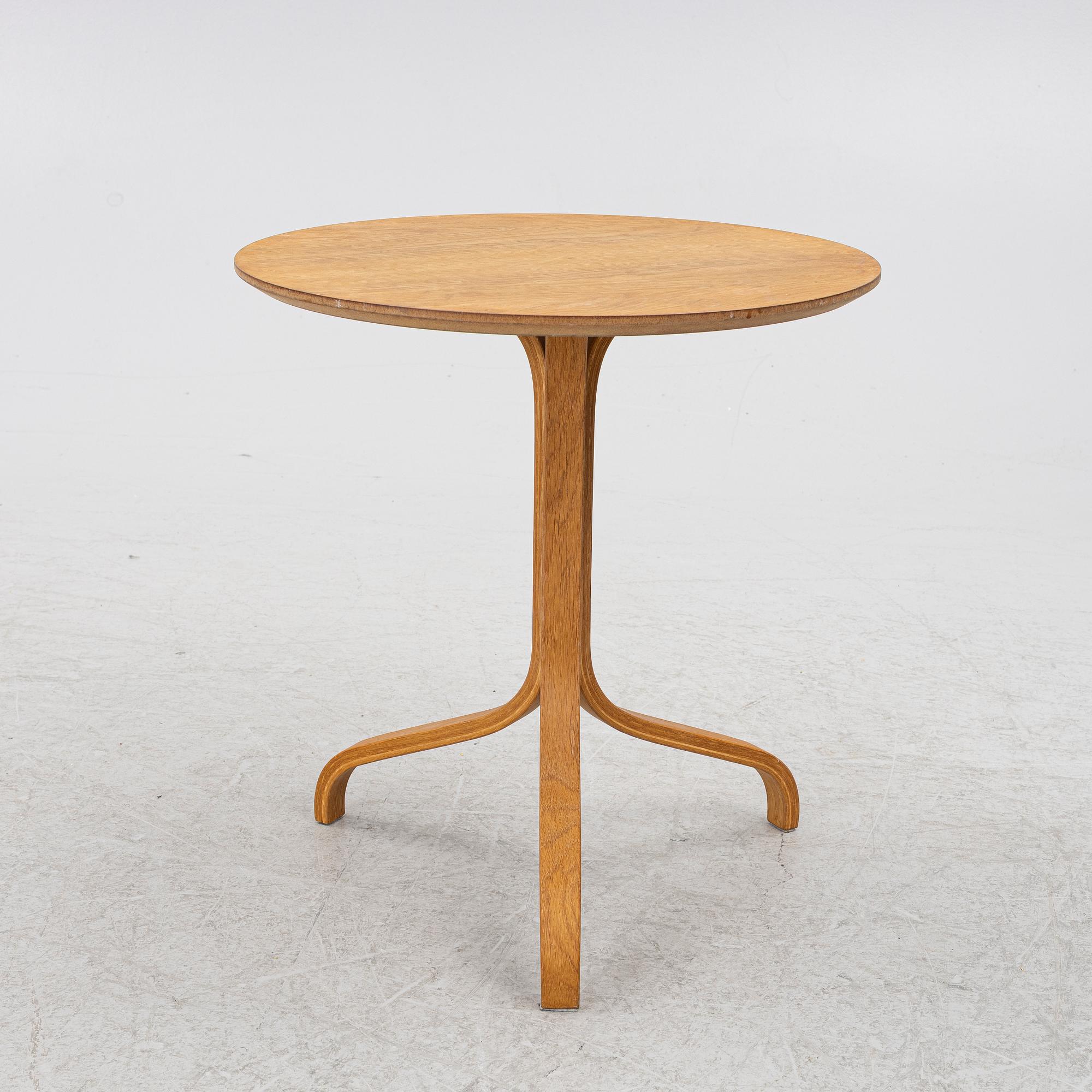 Yngve Ekström, a 'Lamino' armchair with ottoman and sidetable, Swedese, Sweden, 21st century.
