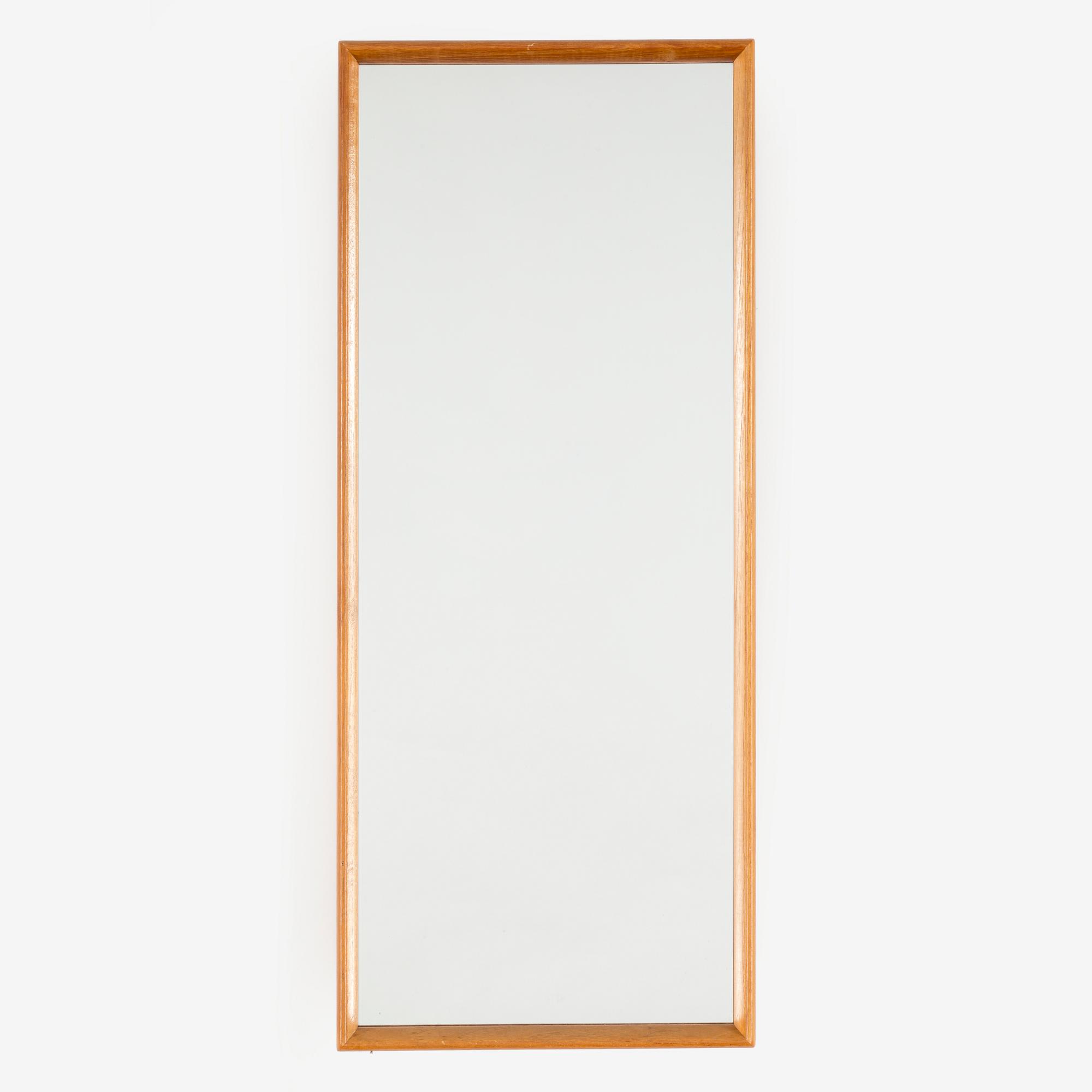 A SWEDISH MIRROR AND TABLE, oak and teak, signed with label "Eriksmåla glas". 1960s.