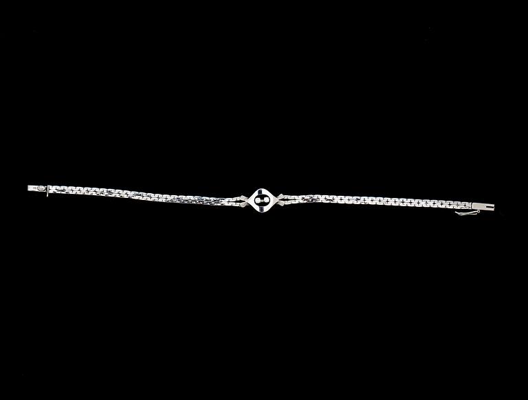 ARMLÄNK, 18 k vitguld med briljantslipade diamanter ca 0,06 ct. Vikt ca 7,5 g.
