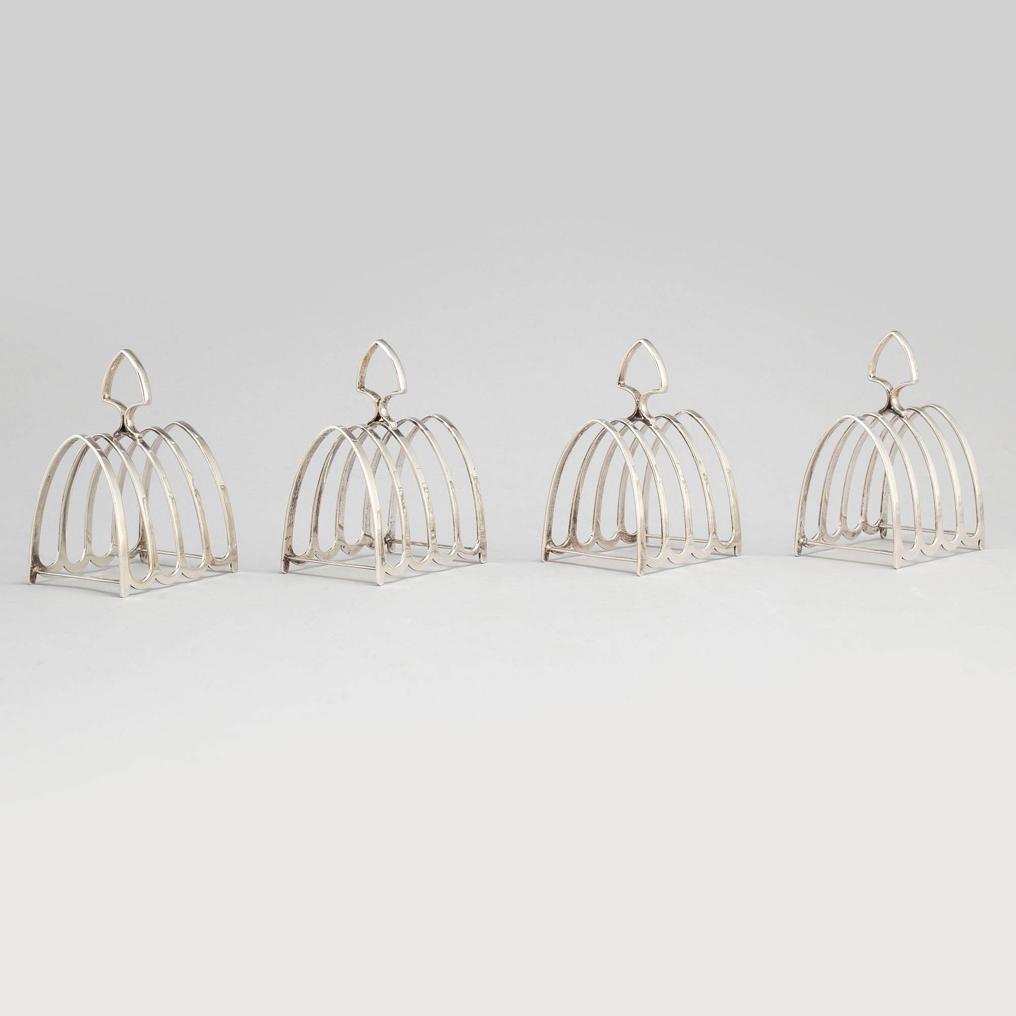 a set of four silver toastracks, Barker Brothers Birmingham 1936.
