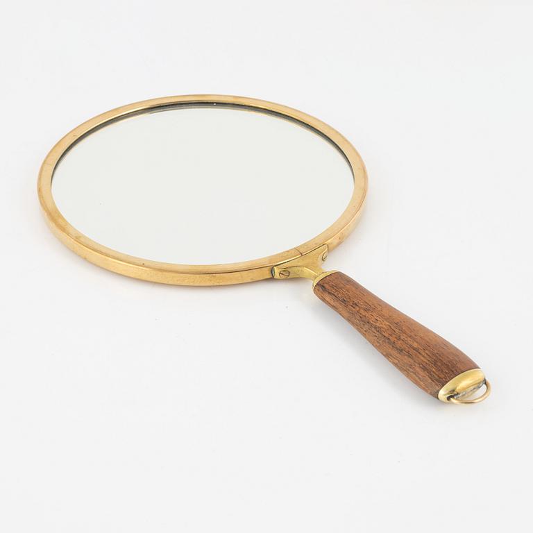 A hand mirror by Svenskt Tenn, model number H 2156, designed in 1935-36.