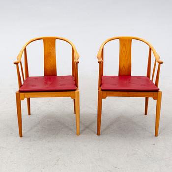 Hans J Wegner, a pair of "China" chairs for Fritz Hansen, Denmark, dated 1994.