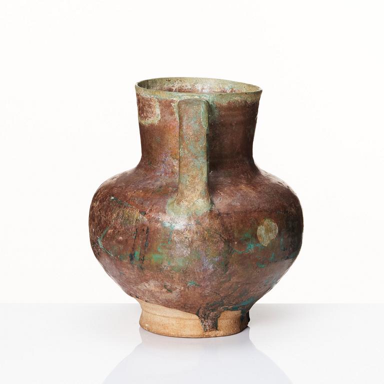 A 12-13th century turquoise and black underglazed jug.