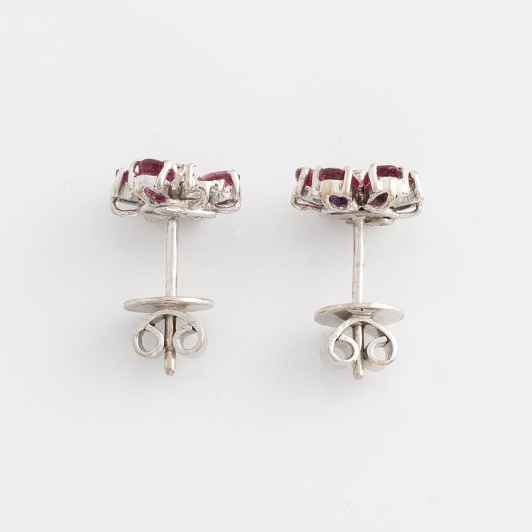 Earrings, one pair, white gold with rubies and small diamonds.