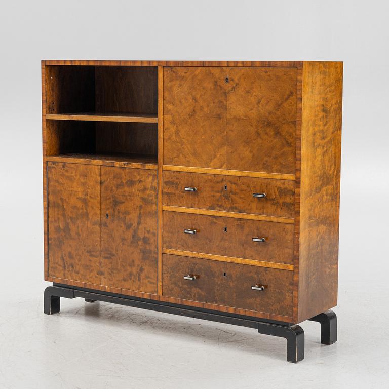 A 1930's birch-veneered bookcase.