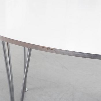 A 'Supercircular' table by Bruno Mathsson & Piet Hein for Fritz Hansen, dated 1985.