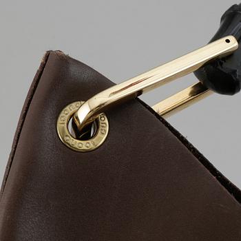 Gucci, a leather bag.