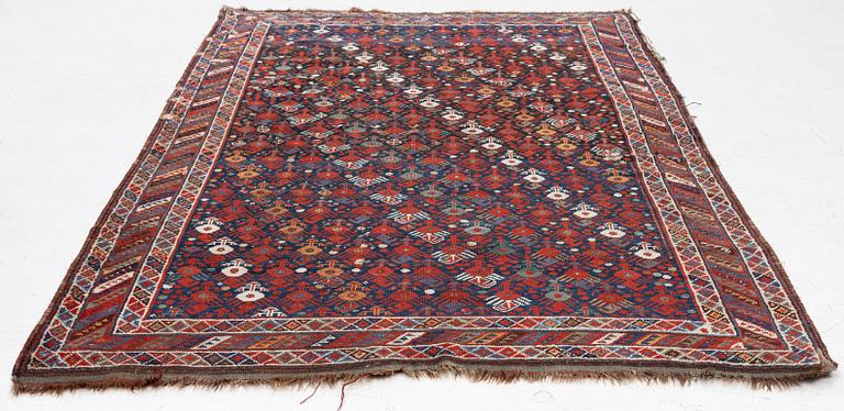 An antique Qashgai rug, 230 x 135 cm.