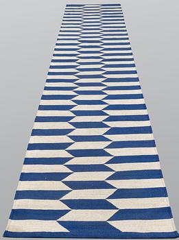 A runner, flat weave, ca 395 x 84 cm.