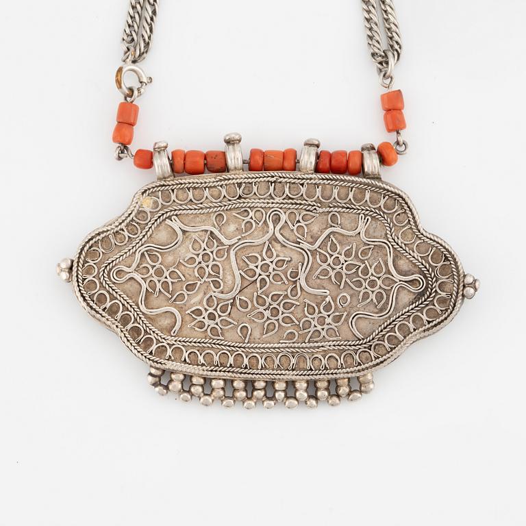 Silver and coral necklace.