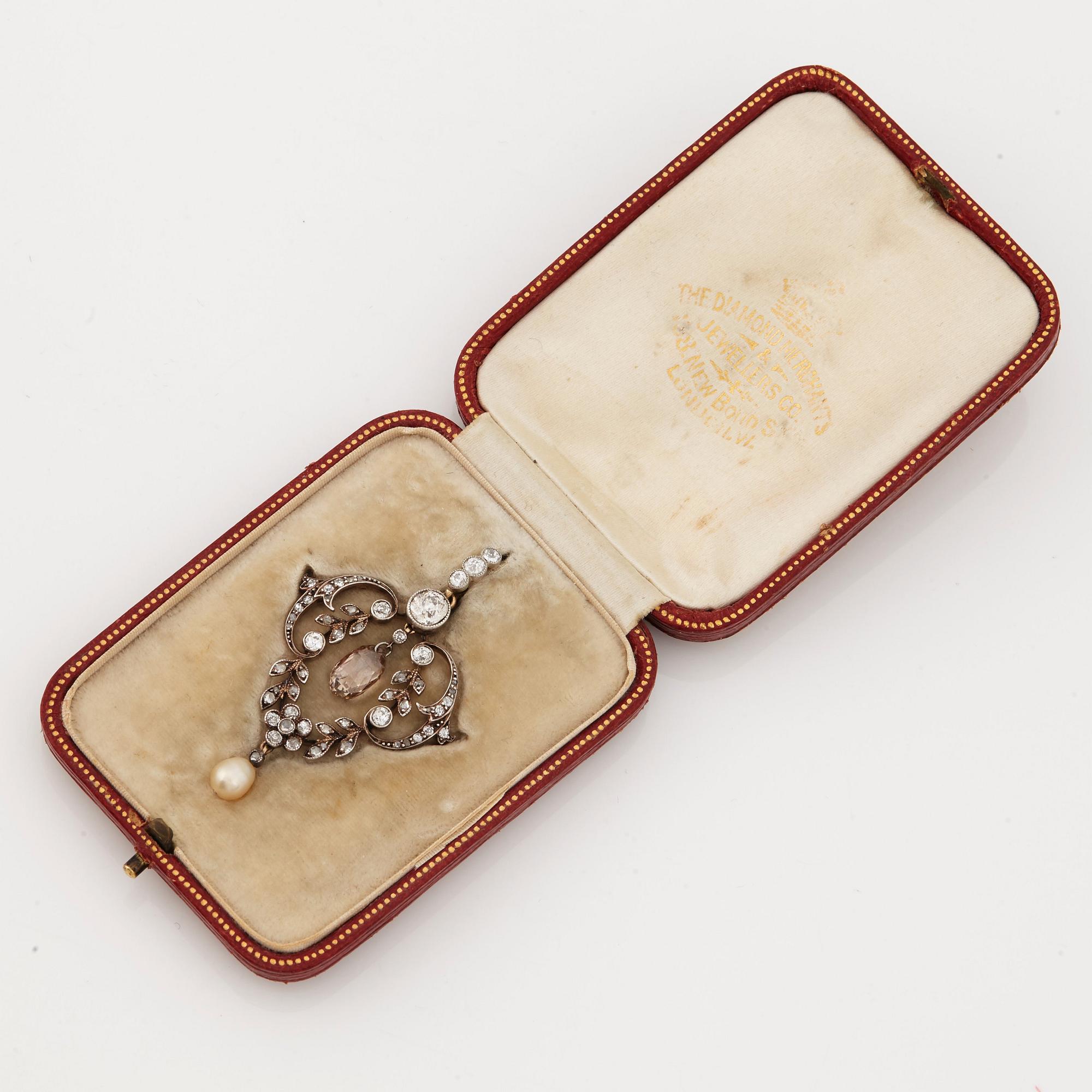 A natural pearl, old-, rose-and briolette cut diamond pendant. Early 20th cent.