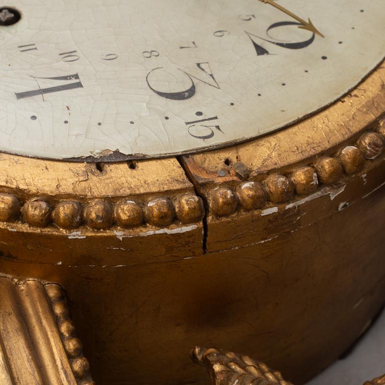 A Gustavian wall clock, late 18th century.