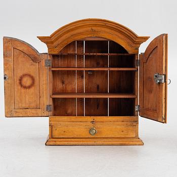 A wall cabinet, 18th century.