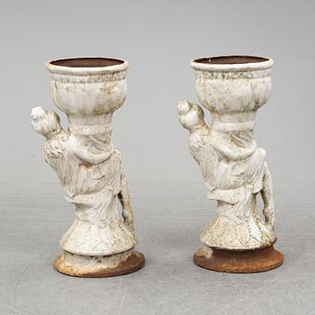 An end of the 20th Century pair of cast  iron flower pots.