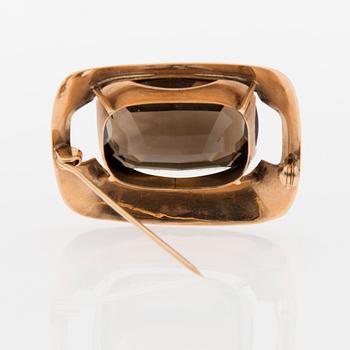 BROSCH, E. Granit. Fasettslipad rökkvarts, 14K guld.