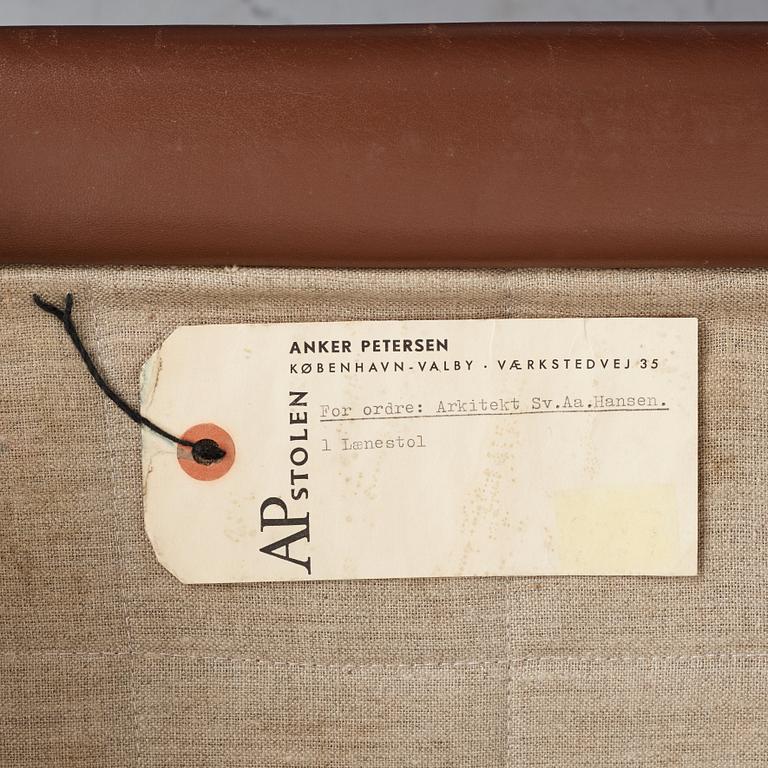 Hans J. Wegner, a pair of "AP-65" easy chairs with stools, AP-stolen, Denmark 1960's.