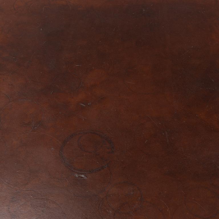 An oak and leather coffee table, mid 20th Century.