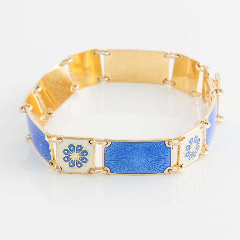 David Andersen, bracelet and two brooches, gilded silver and enamel, Norway.