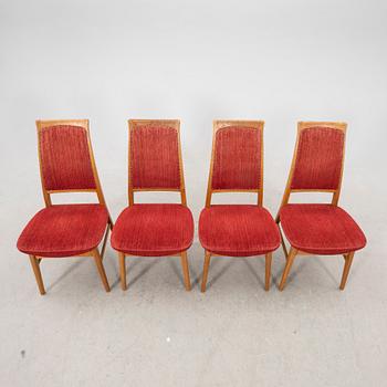 A set of four  mid 1900s teak chairs.