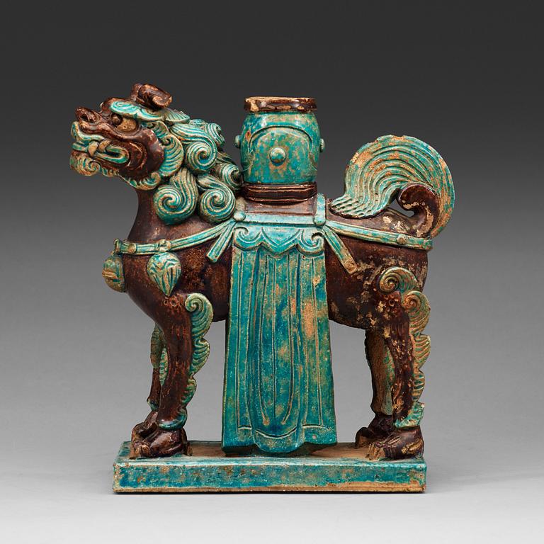 A turkoise and aubergine glazed figure of a Mythical beast, late Ming dynasty (1368-1644).