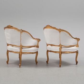 A pair of 20th century easy chairs.