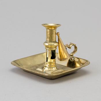 An 18th/19th century brass candlestick.